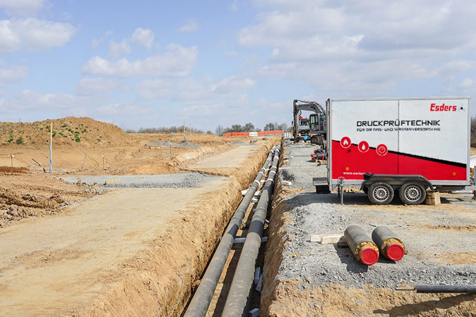 District heating track construction site with a pressure test trailer